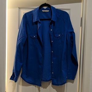 Blue long sleeved button up shirt